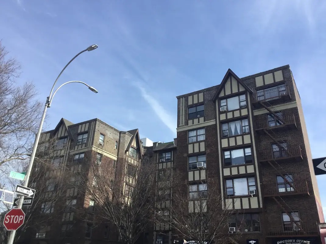 A street in Jackson Heights, Queens, a neighborhood of garden apartments and food counters